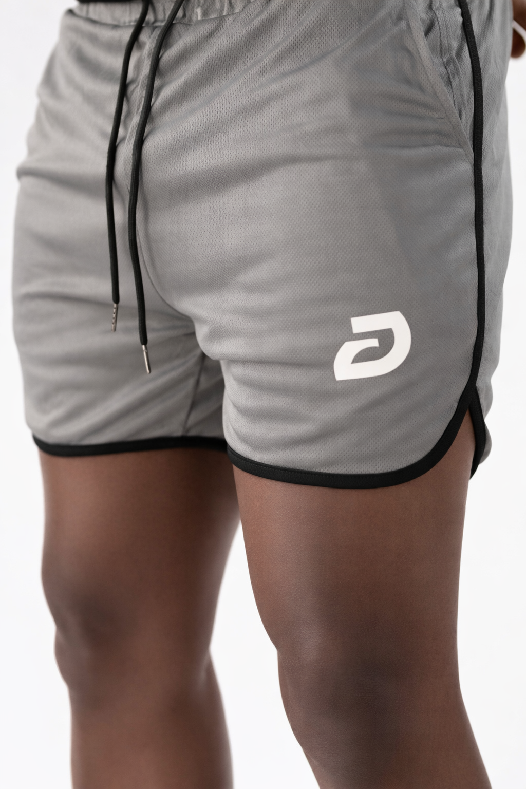 Gray shorts with a logo on a white background
