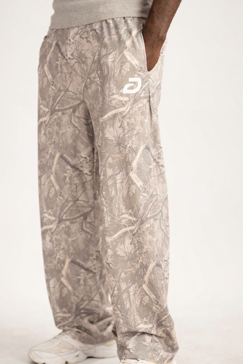Camouflage pants with a brand logo on a white background